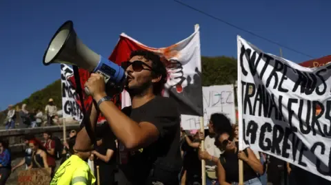 France-Wide Strikes Break Out Against Budget Reductions